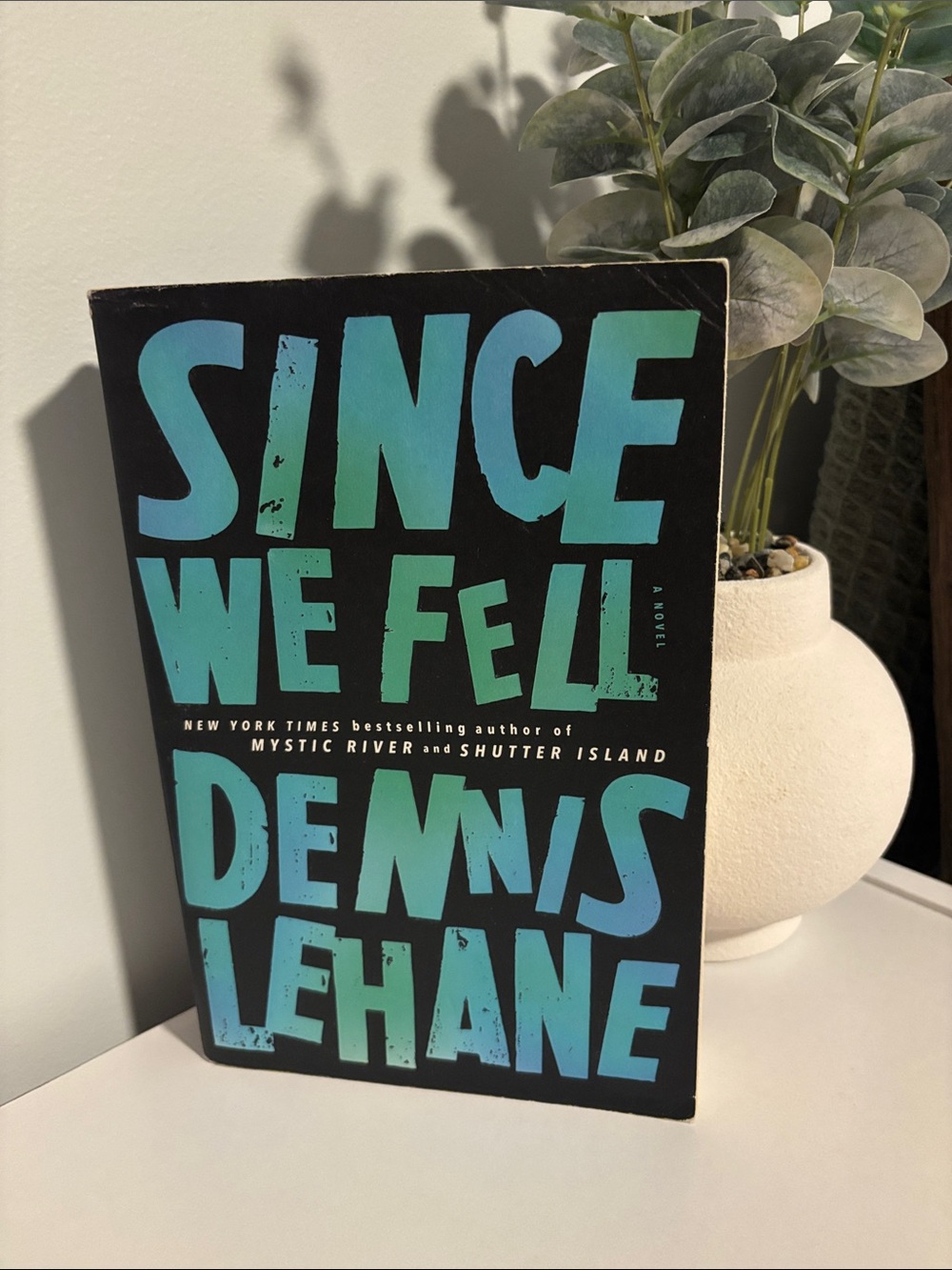 Since We Fell by Dennis Lehane — Black Paperback with Teal/Blue Cover Text